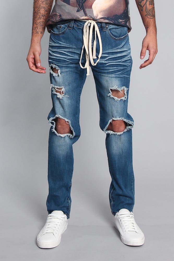 Threadbare faded jeans, front view