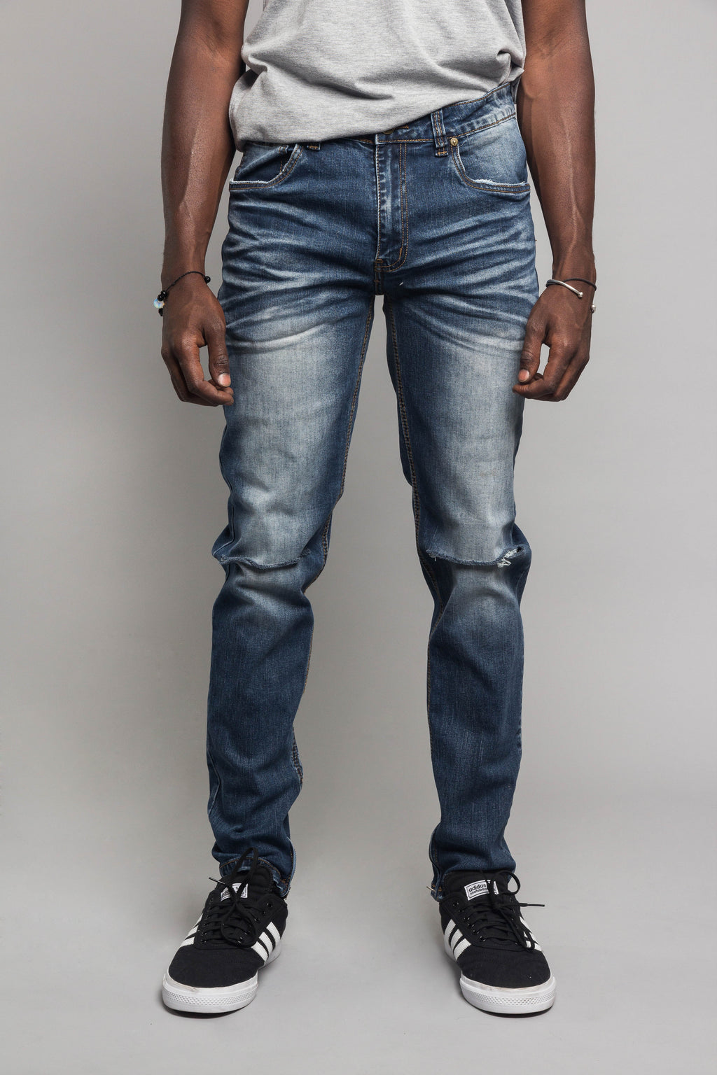 Indigo skinny jeans with knee slits
