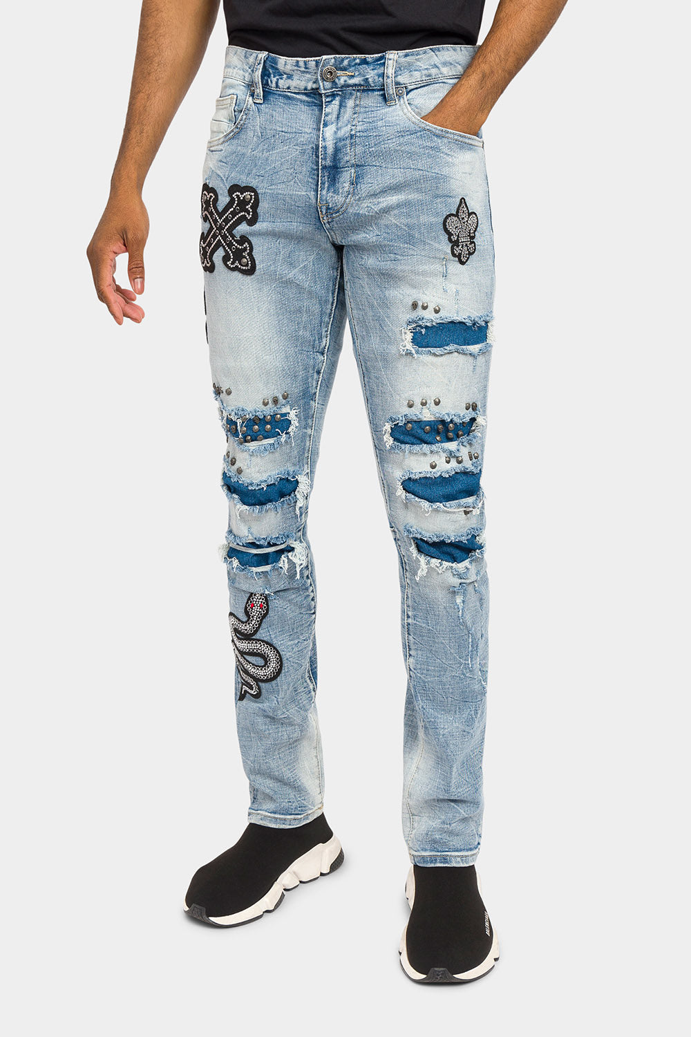 Blue distressed jeans with crystal patches, front view