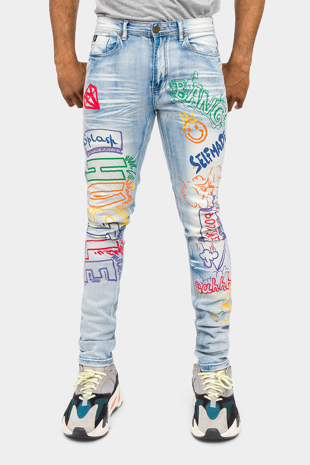 Faded indigo jeans with graffiti artwork